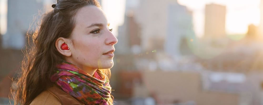 woman wearing ear translater