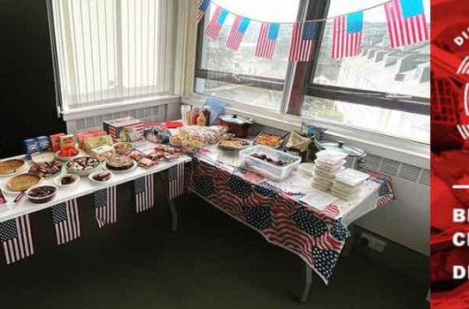 TorFX USA Celebration Day buffet with selection of American foods. TorFX Logo and the British Red Cross DEC ember appeal logo.